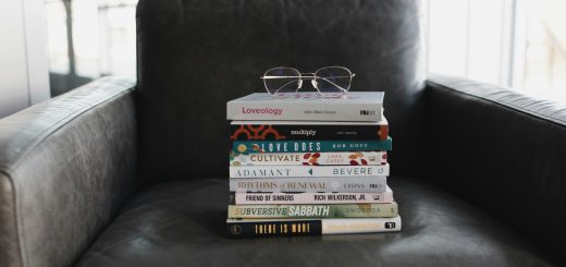 Photo of books on an armchair by Alexandra Fuller on Unsplash